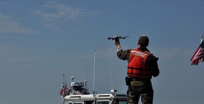 A Marine launches an InstantEye vertical takeoff and landing unmanned aircraft system (UAS) Aug