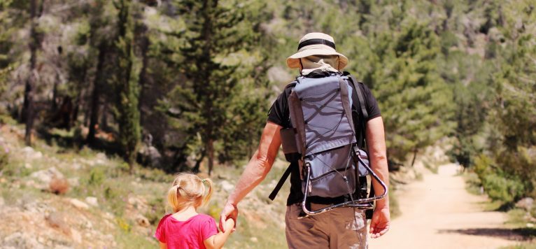 Dad and kid hiking