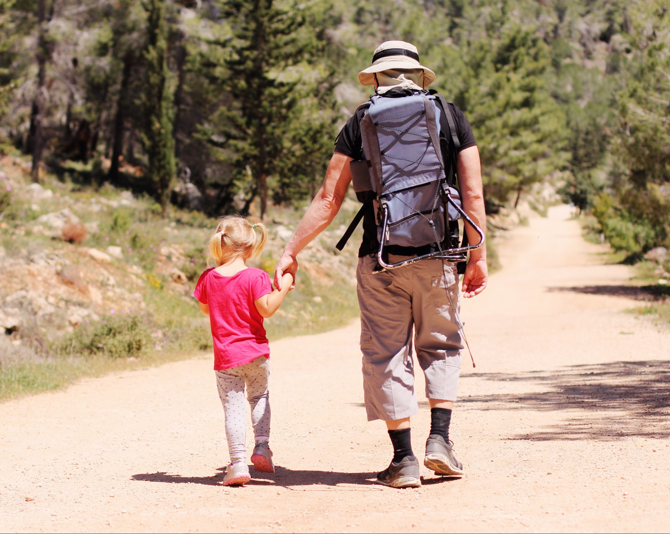 Dad and kid hiking
